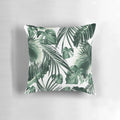 A vibrant, nature-inspired tropical leaves pillow with a collage-style design in shades of green and white.