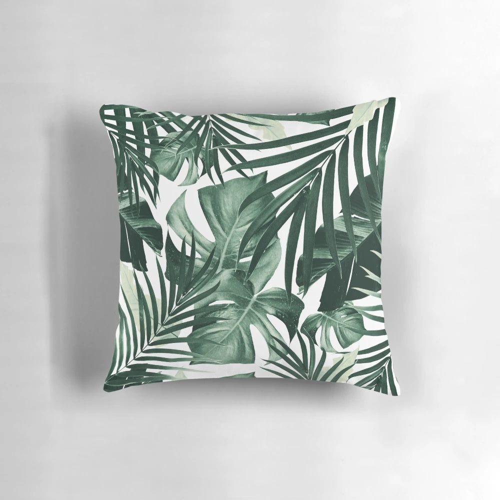 Tropical jungle leaves pattern decorative pillow with lush foliage and botanical designs.