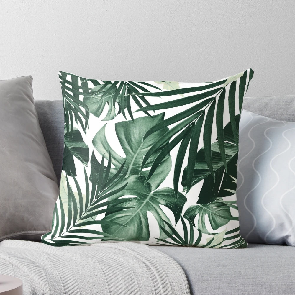Tropical jungle leaves pattern decorative pillow with lush foliage and botanical designs.