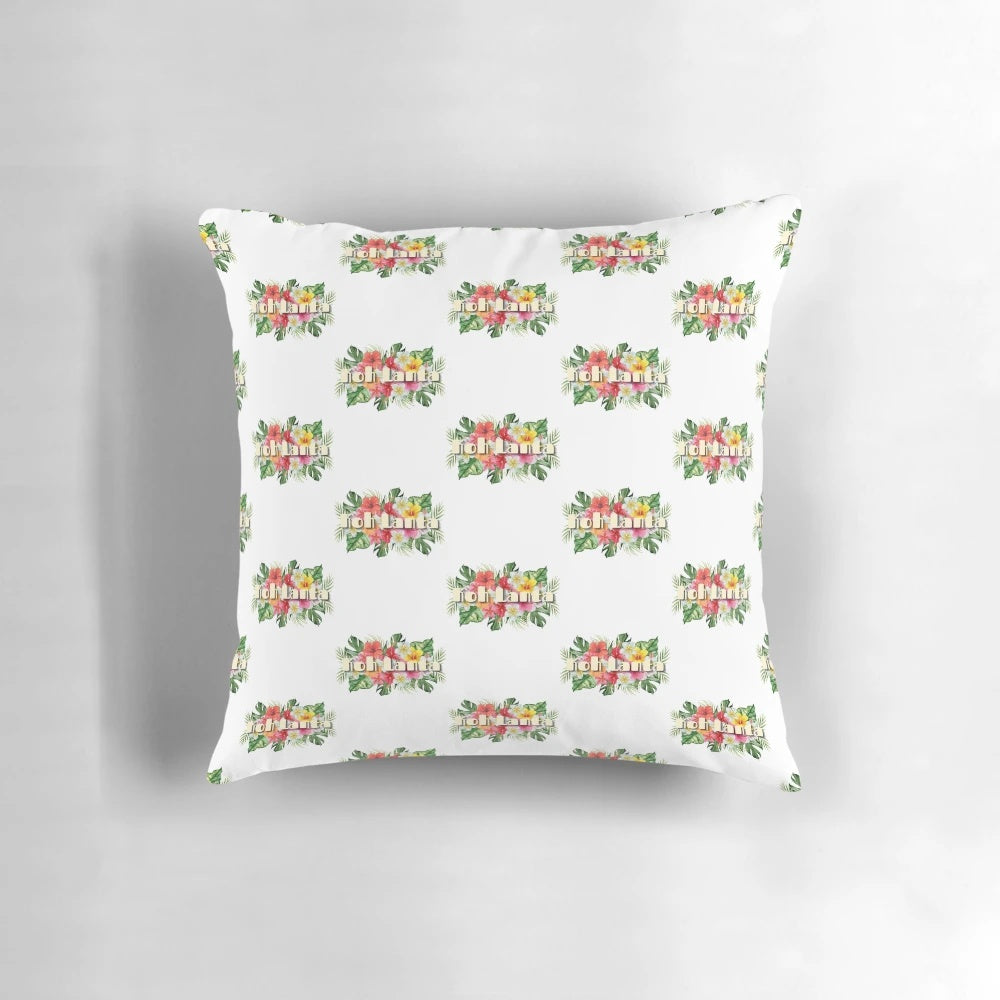 Vibrant tropical flowers in shades of pink, purple, and green adorn this Koh Lanta-inspired throw pillow.