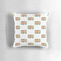 Vibrant tropical flowers in shades of pink, purple, and green adorn this Koh Lanta-inspired throw pillow.