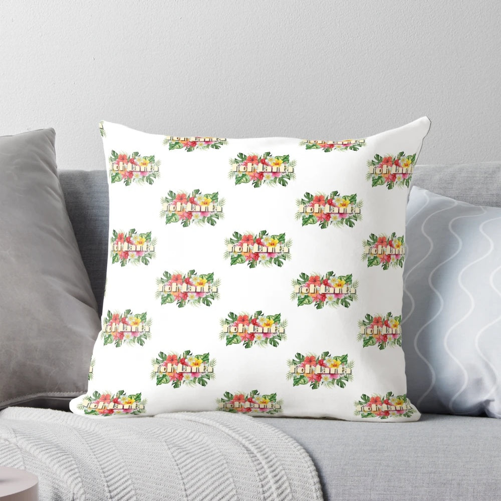 Vibrant tropical flowers in shades of pink, purple, and green adorn this Koh Lanta-inspired throw pillow.