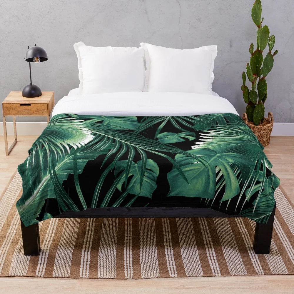 Tropical leaf collage plush blanket featuring vibrant botanical art
