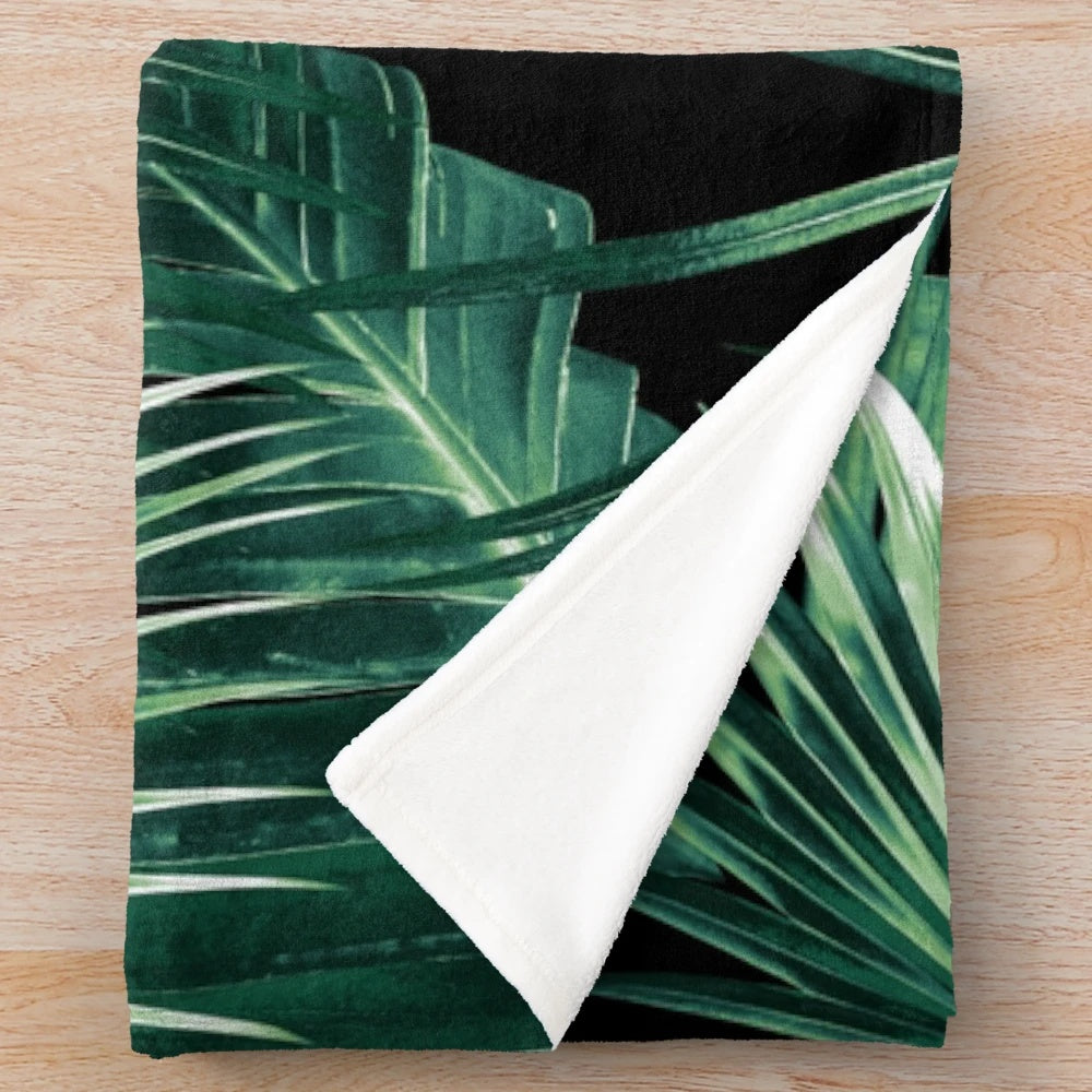 Tropical leaf collage plush blanket featuring vibrant botanical art