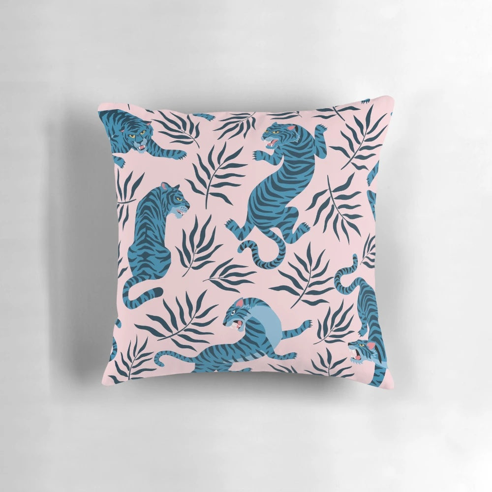 Vibrant tropical leaves and majestic Asian tigers printed on a decorative pillow for a stylish home accent.