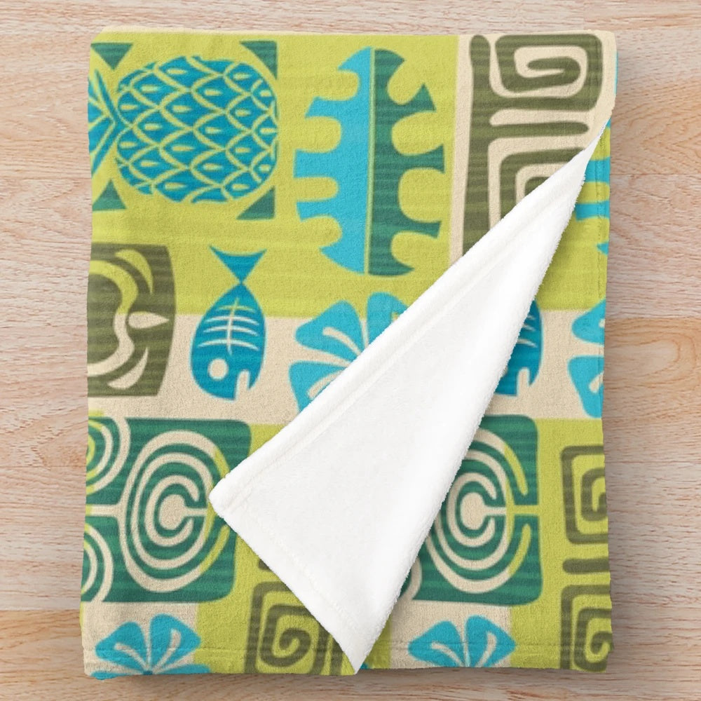 Tropical plush blanket with tiki, surfboard, and pineapple patterns