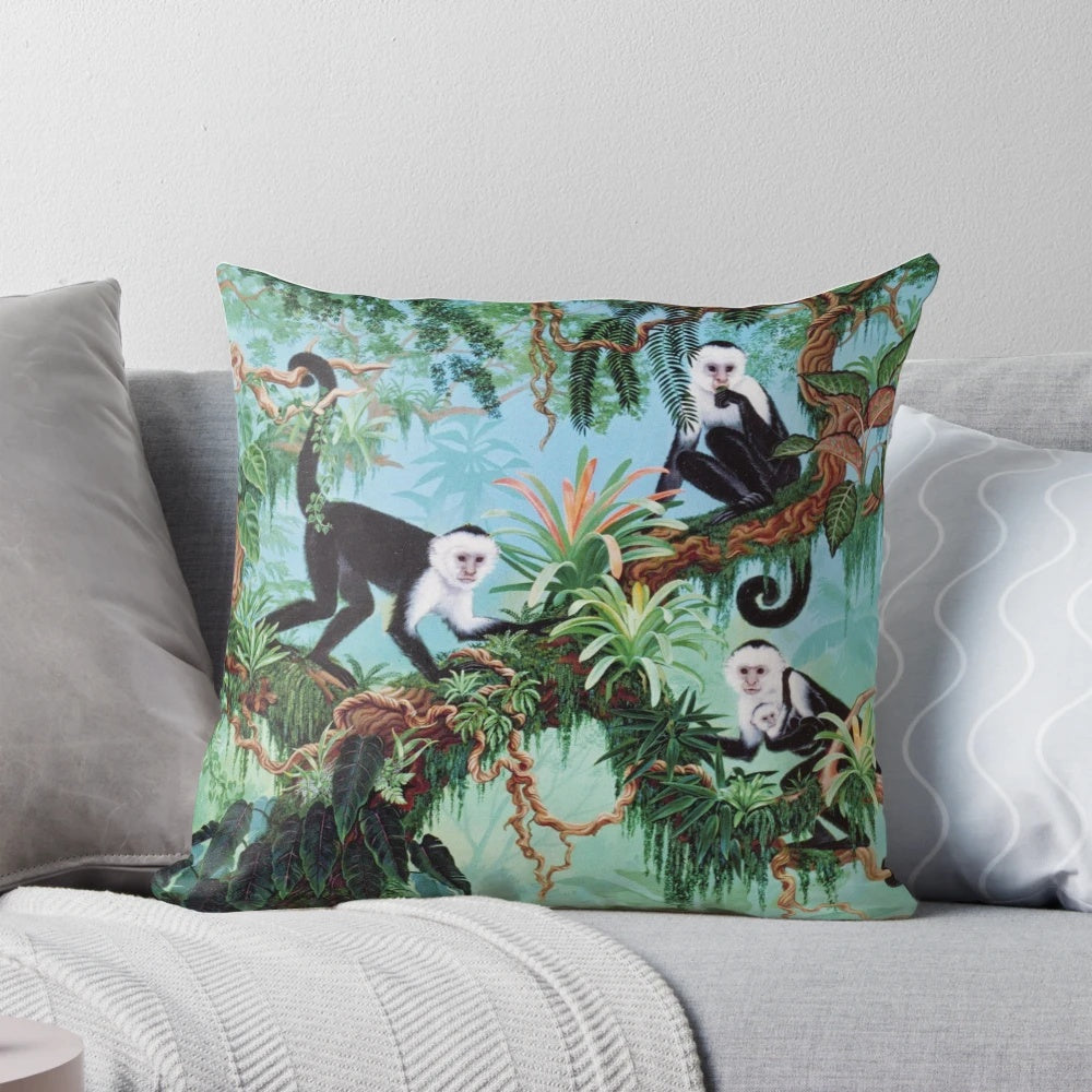 Vibrant monkey-themed pillow with tropical jungle design by artist Jan Betts