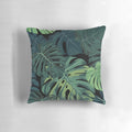 Tropical Monstera leaf pattern printed on a soft, decorative pillow