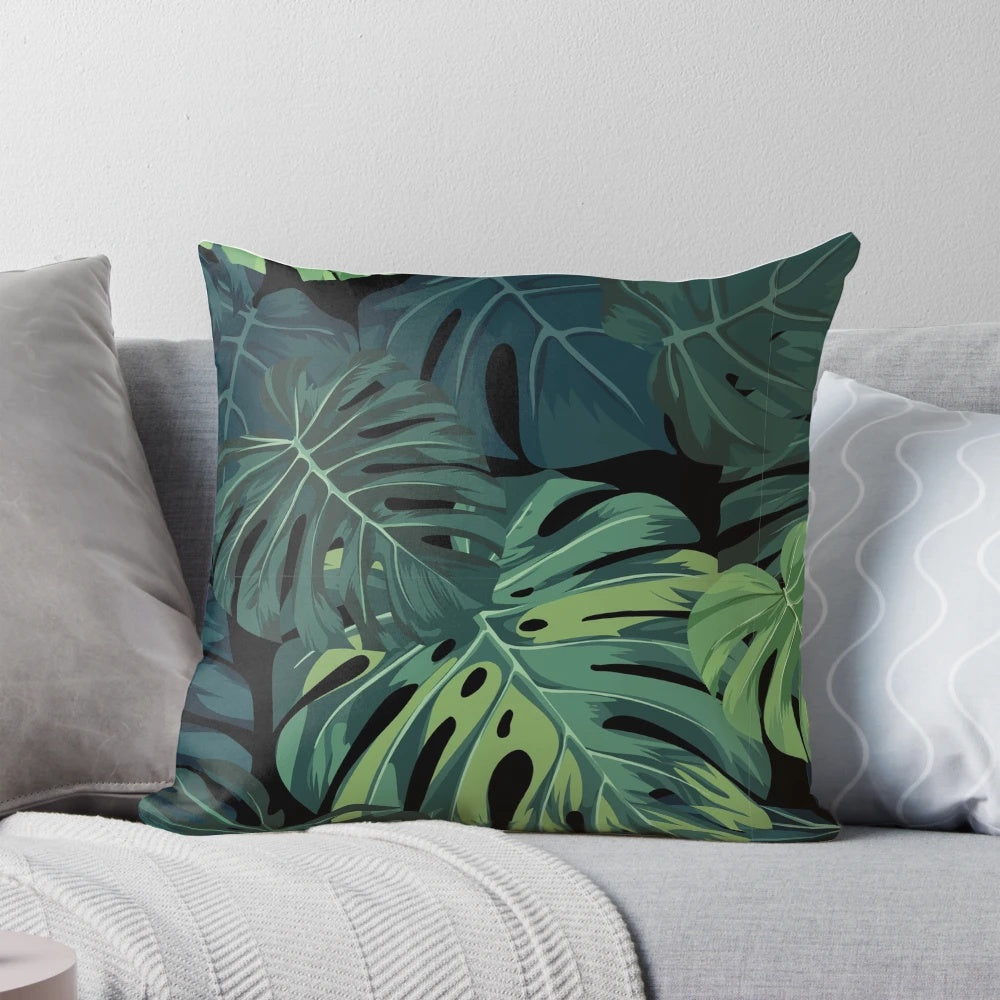 Tropical Monstera leaf pattern printed on a soft, decorative pillow