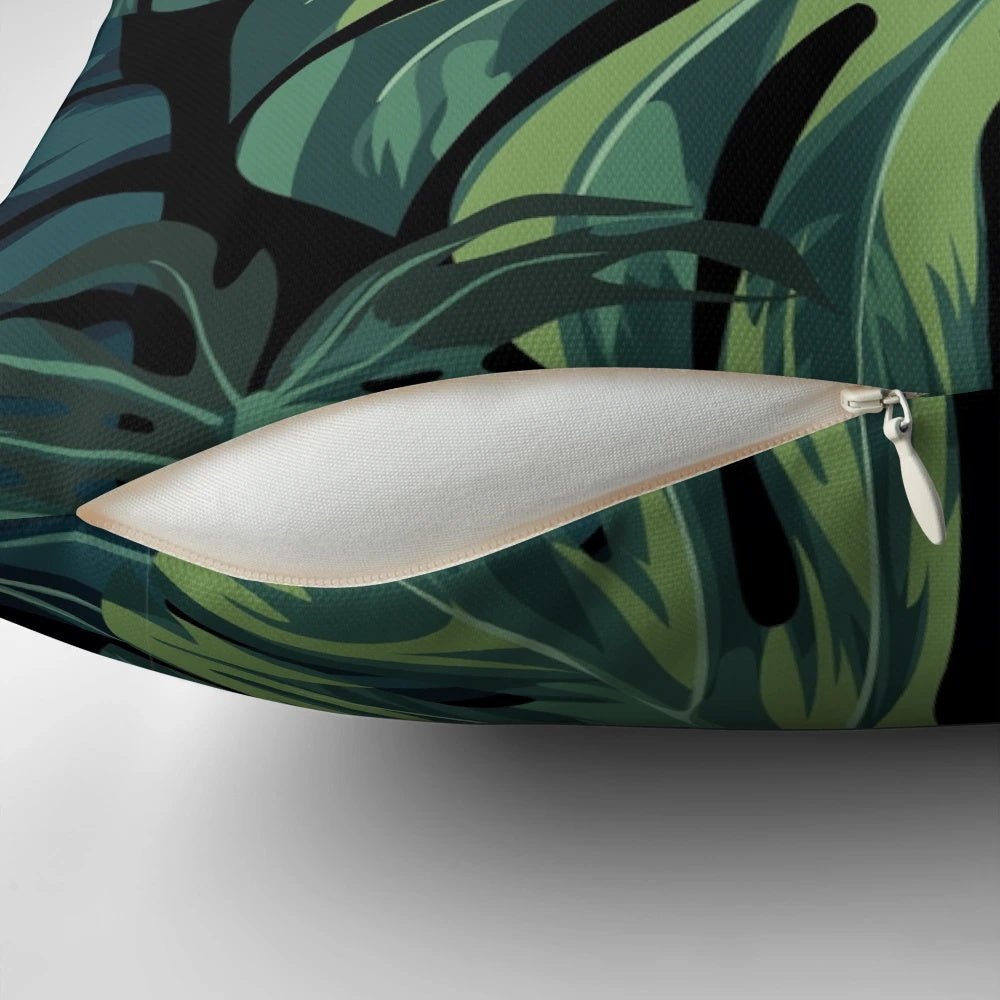 Tropical Monstera leaf pattern printed on a soft, decorative pillow