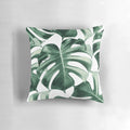 Vibrant tropical monstera leaves pattern on a decorative pillow