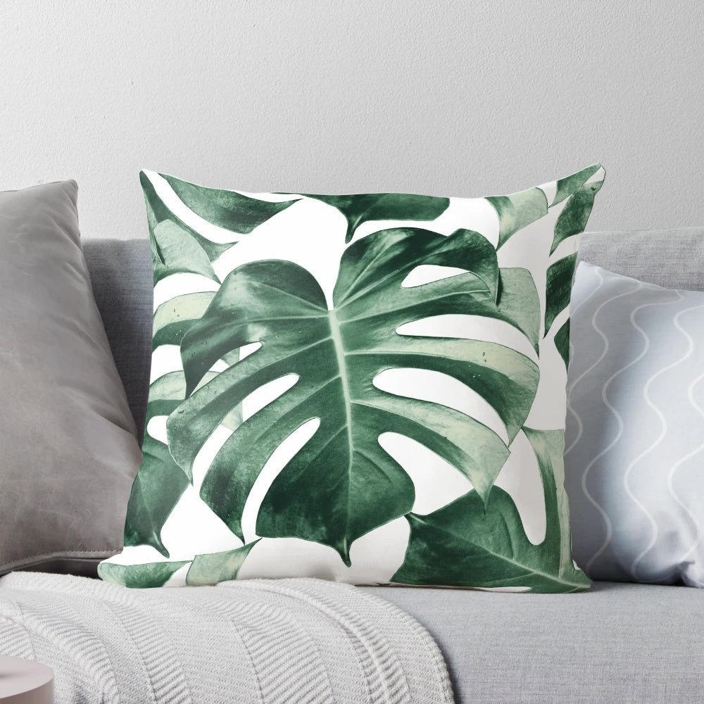 Vibrant tropical monstera leaves pattern on a decorative pillow