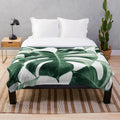 Tropical monstera leaves plush blanket with botanical foliage pattern