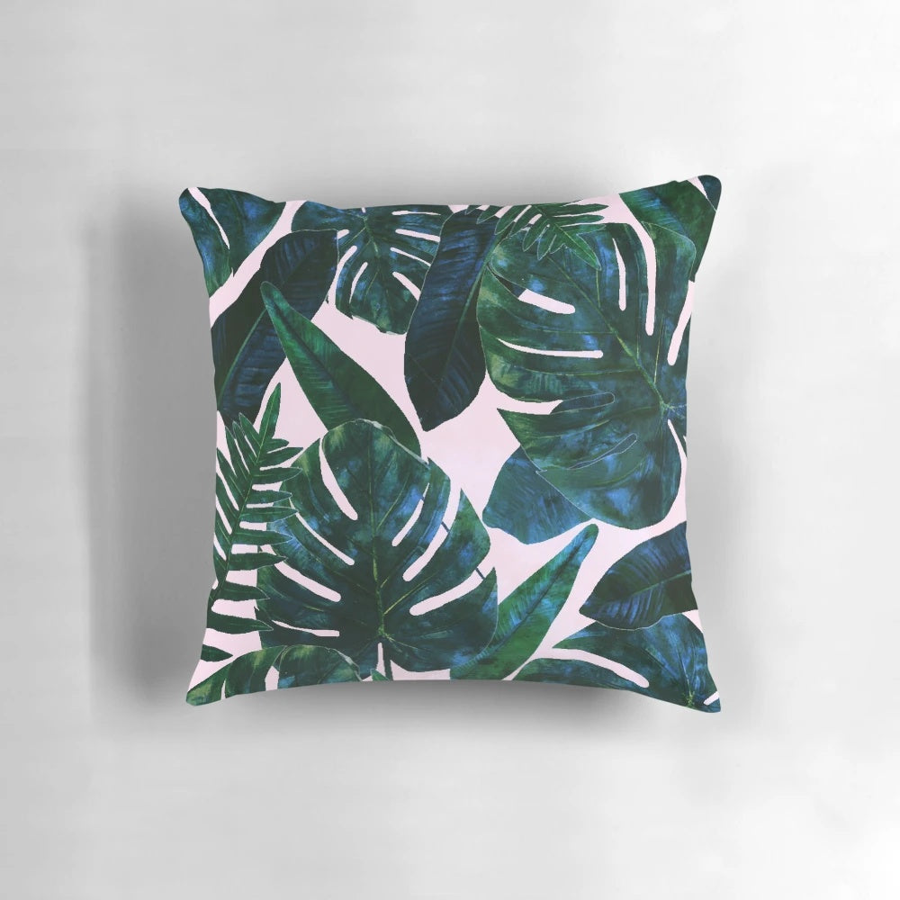 Tropical botanical plants painting featuring palm, monstera, and banana leaves in a lush jungle setting, printed on a decorative pillow.