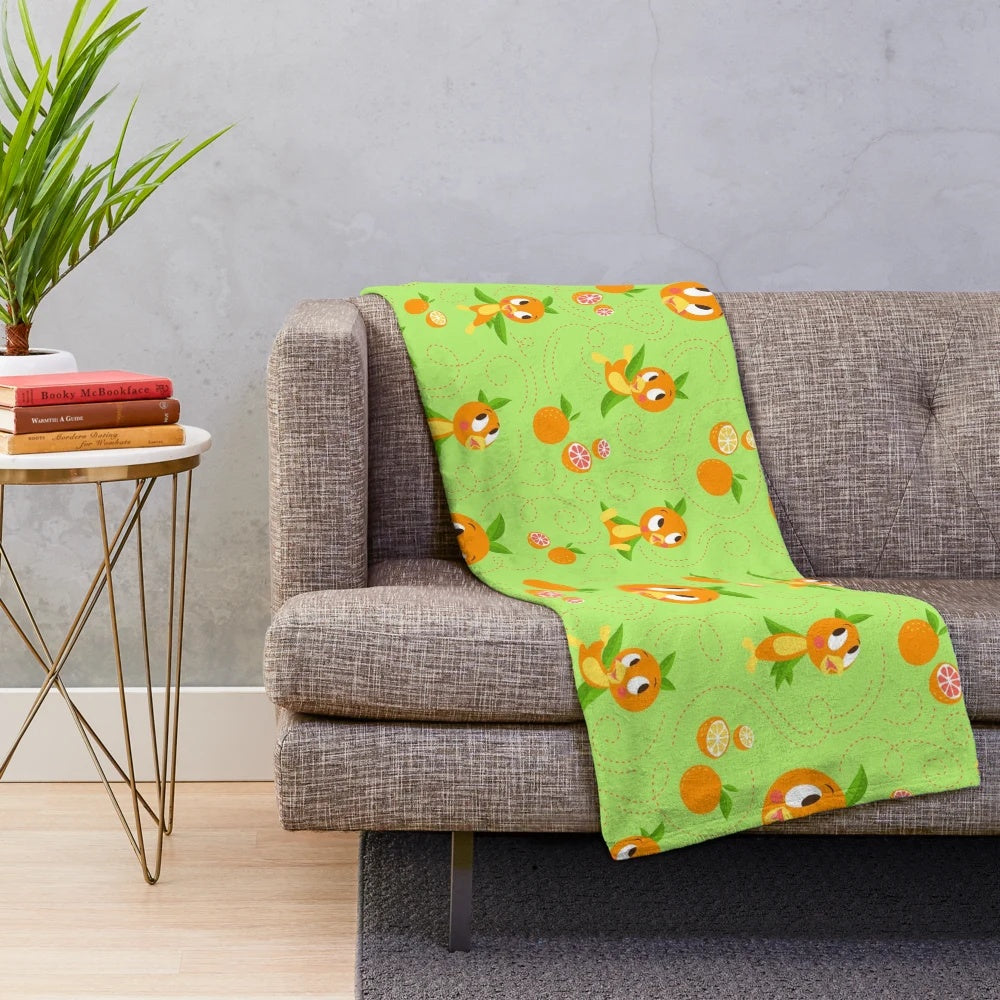 Orange bird plush blanket with a tropical floral background
