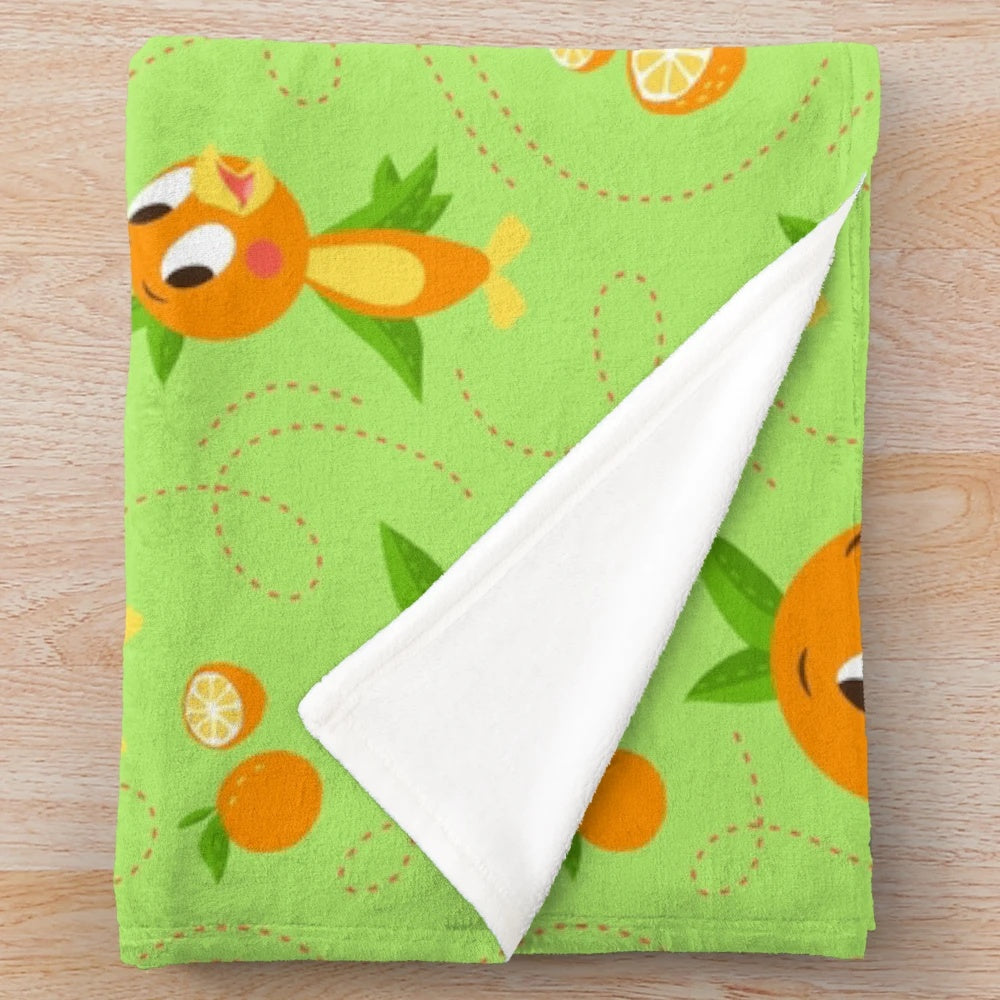 Orange bird plush blanket with a tropical floral background