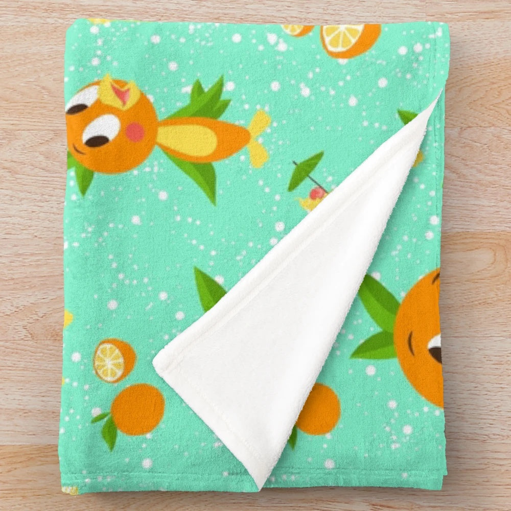 Soft plush blanket featuring an orange bird design inspired by the iconic Dole Whip treat from Walt Disney World's Adventureland