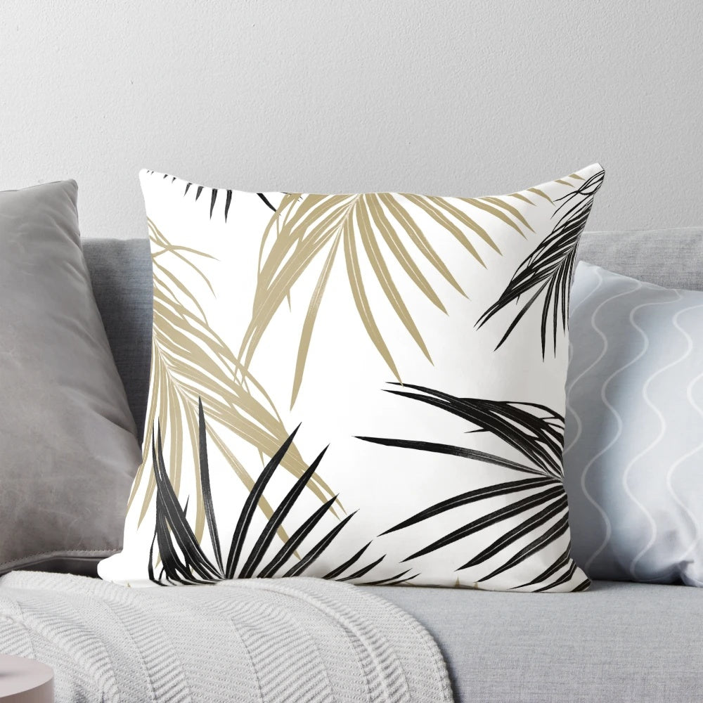 A digital artwork featuring a collage of tropical palm leaves in black, white, and gold tones.
