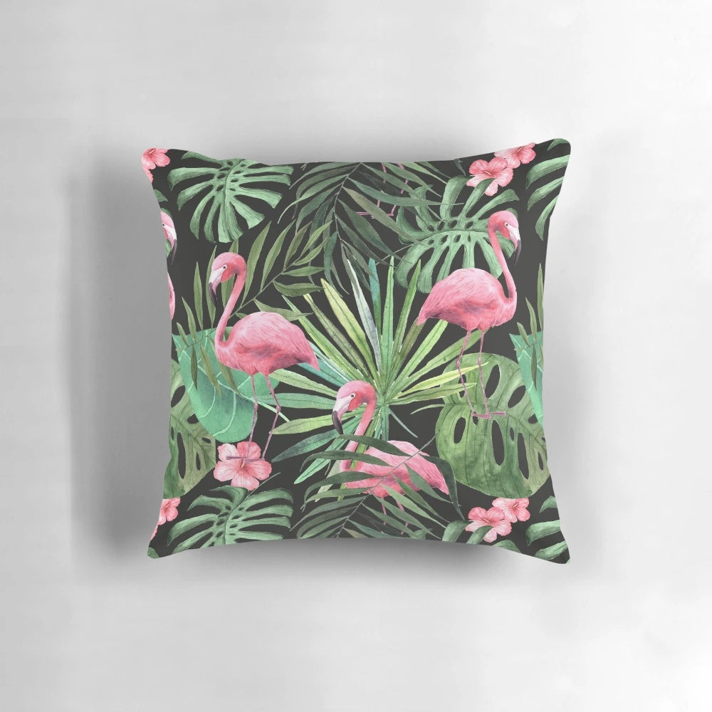 Decorative pillow with a tropical palm leaves and flamingo pattern design
