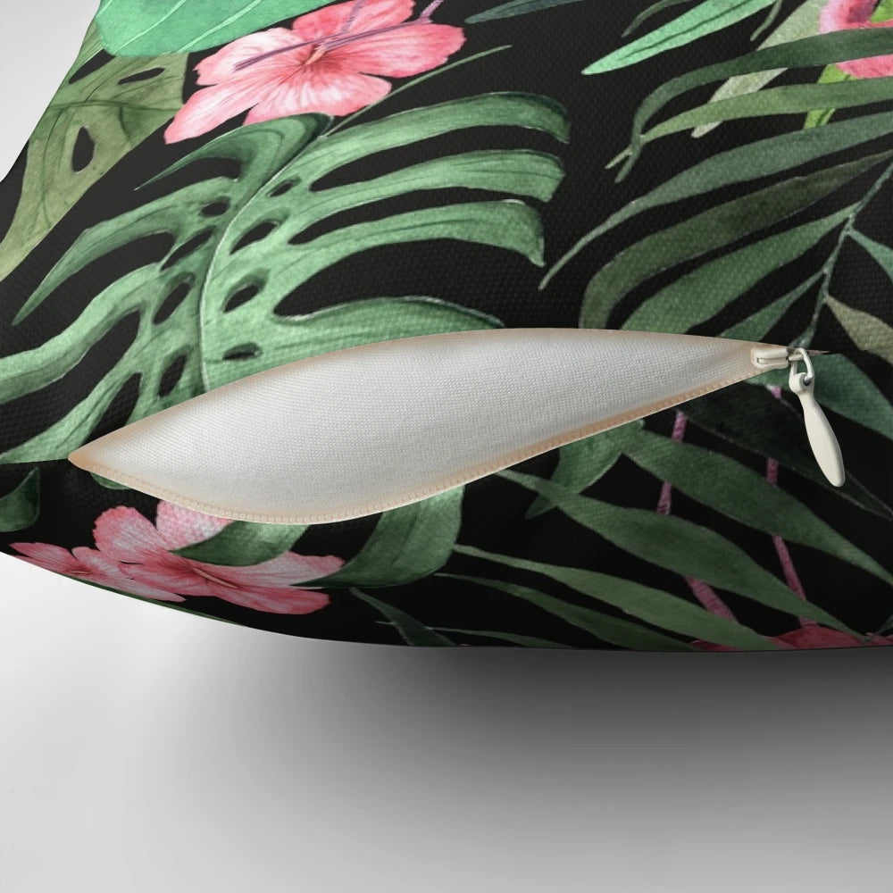 Decorative pillow with a tropical palm leaves and flamingo pattern design