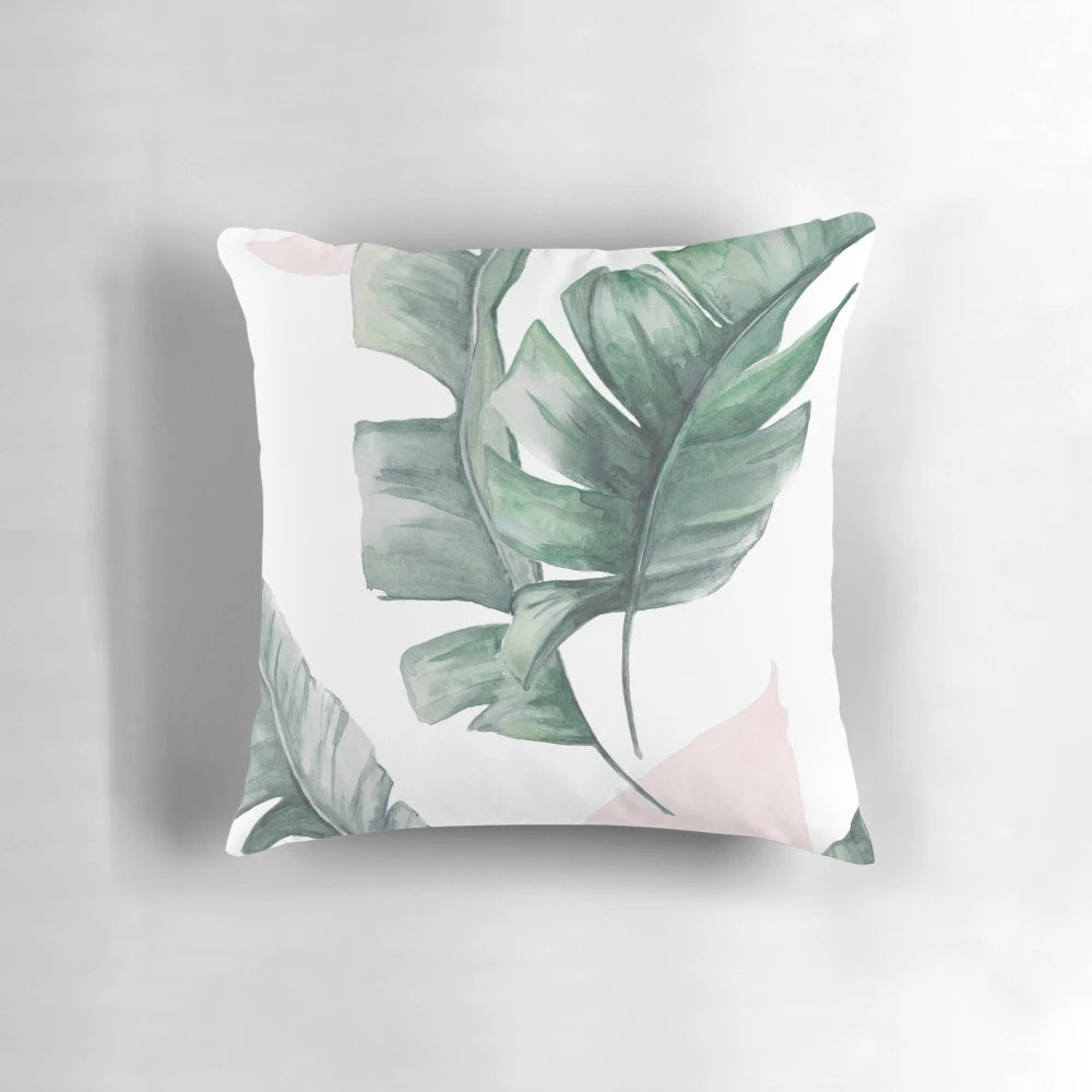 Tropical palm leaves watercolor design on a pillow cover