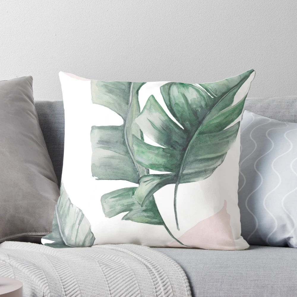 Tropical palm leaves watercolor design on a pillow cover