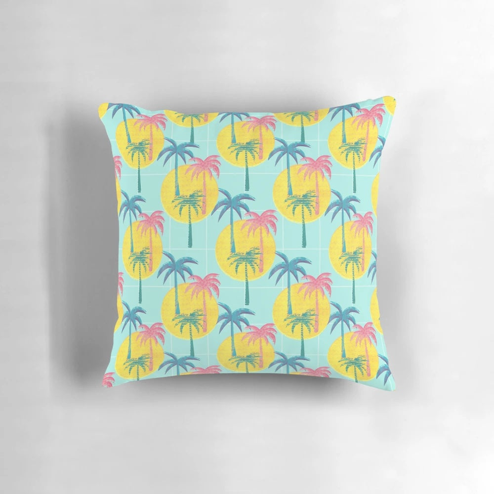 Retro tropical palm tree pattern pillow with blue, pink, and yellow colors