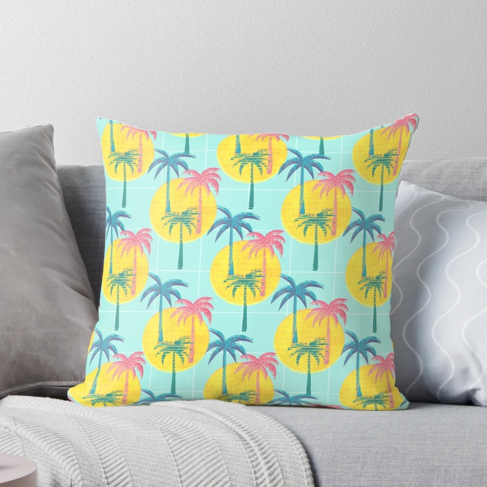 Retro tropical palm tree pattern pillow with blue, pink, and yellow colors
