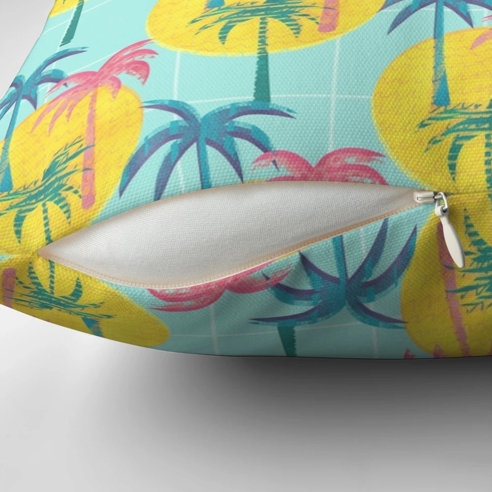 Retro tropical palm tree pattern pillow with blue, pink, and yellow colors