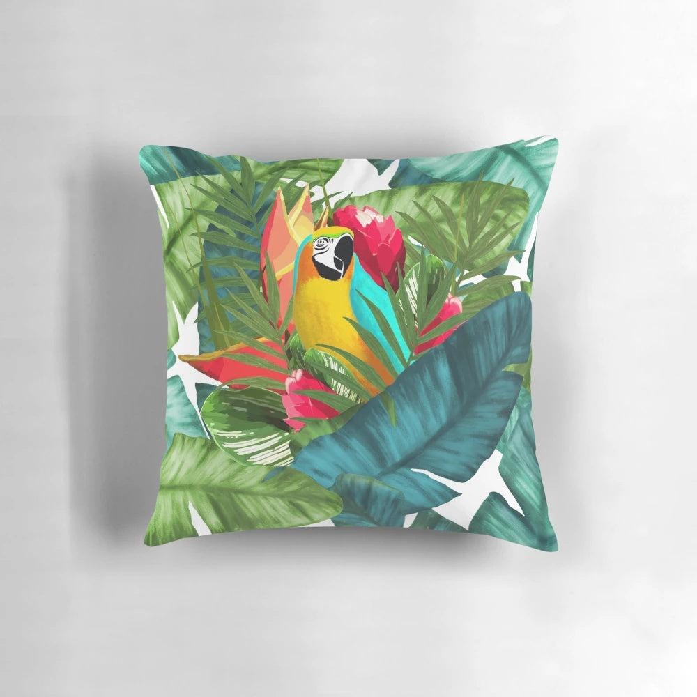 Vibrant tropical parrot design with banana leaves on a pillow