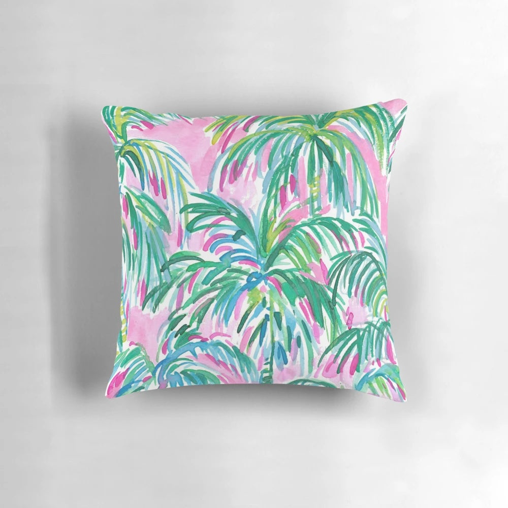 Decorative throw pillow with a tropical pink palm tree design inspired by Lilly Pulitzer's signature style