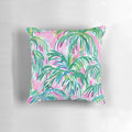 Decorative throw pillow with a tropical pink palm tree design inspired by Lilly Pulitzer's signature style