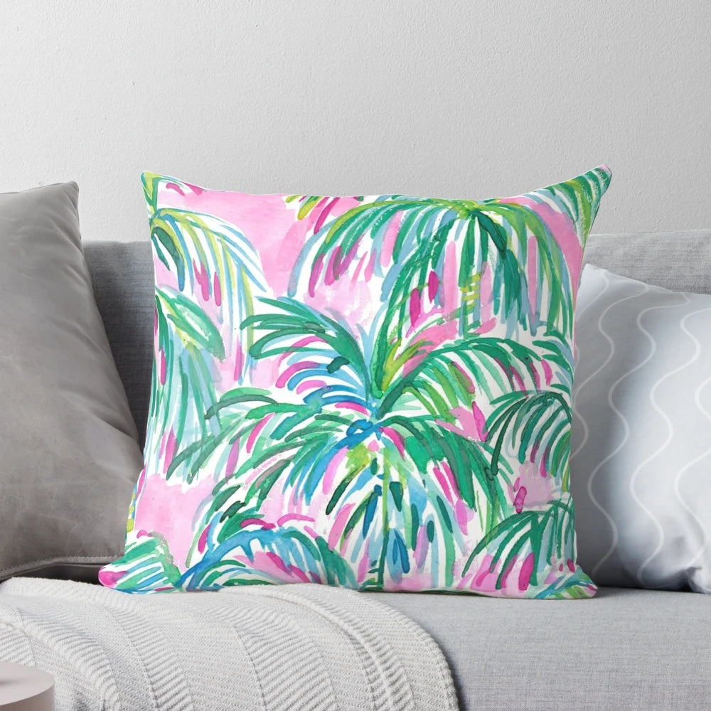 Decorative throw pillow with a tropical pink palm tree design inspired by Lilly Pulitzer's signature style