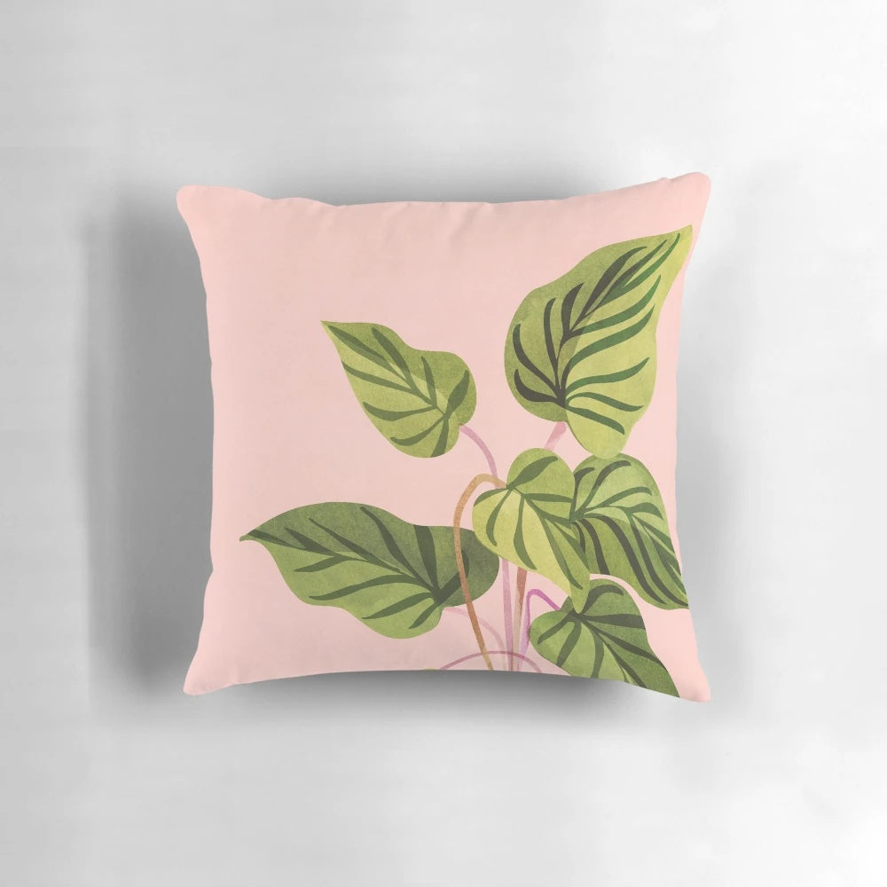 Tropical plant pillow with lush pink and green botanical leaves, perfect for mid-century or whimsical home decor