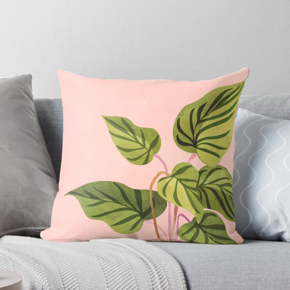 Tropical plant pillow with lush pink and green botanical leaves, perfect for mid-century or whimsical home decor