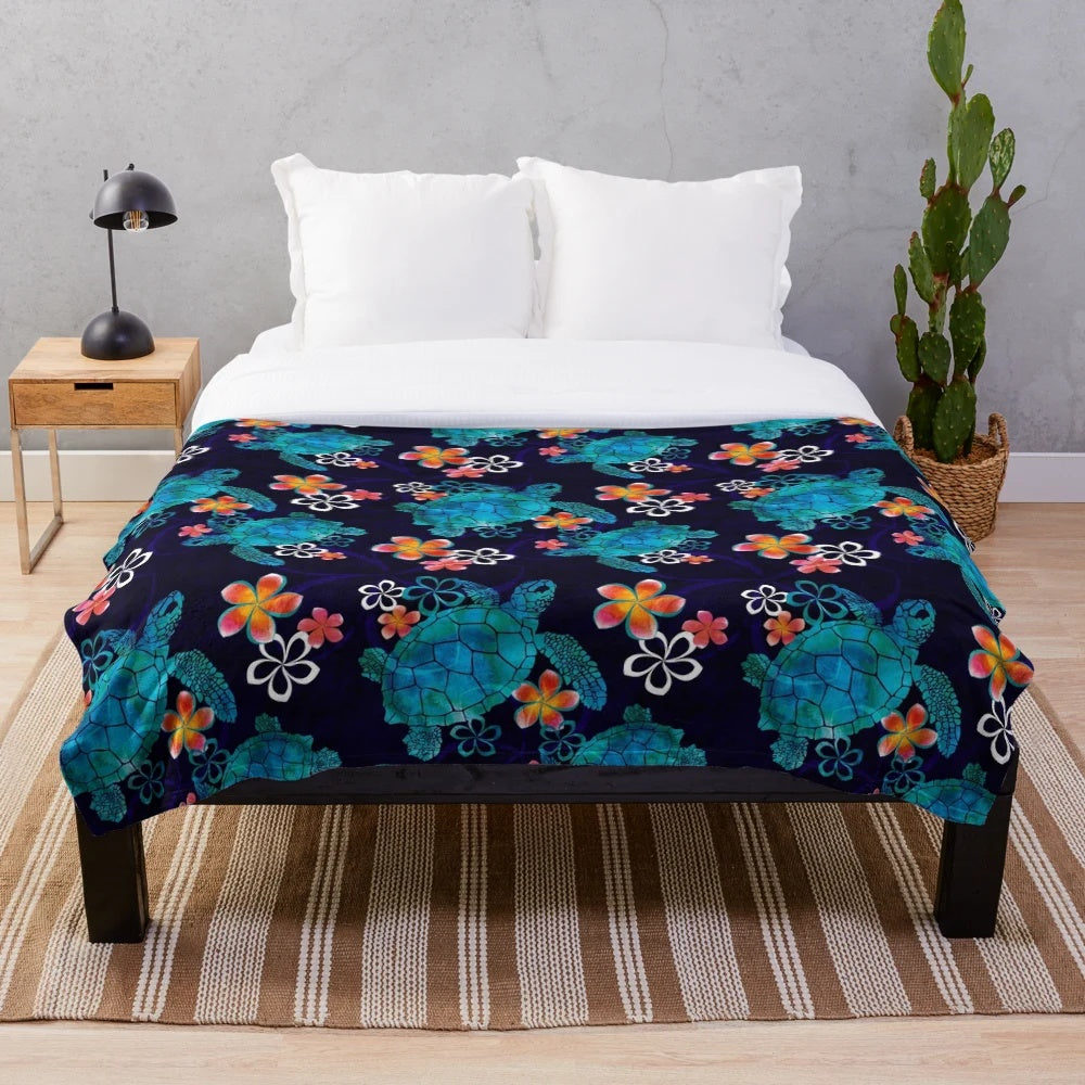 Plush blanket featuring a sea turtle design with tropical flowers