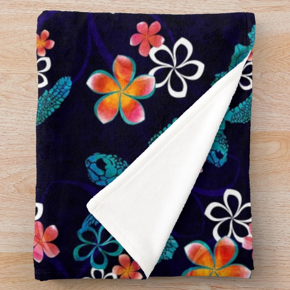 Plush blanket featuring a sea turtle design with tropical flowers