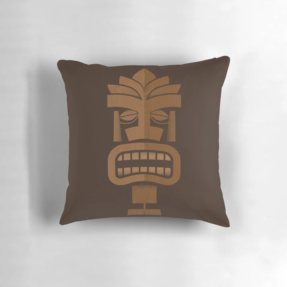 A vibrant Tiki-inspired pillow with a tropical pattern, perfect for adding a touch of Hawaii-inspired style to your coastal home.
