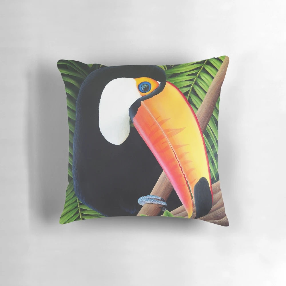 A vibrant, tropical toucan bird printed on a decorative accent pillow, creating a lush, jungle-inspired ambiance.