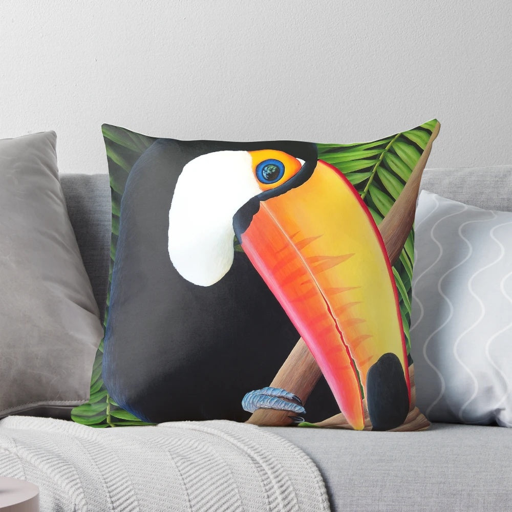 A vibrant, tropical toucan bird printed on a decorative accent pillow, creating a lush, jungle-inspired ambiance.