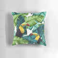 Tropical pillow with a colorful pattern featuring toucans and banana leaves