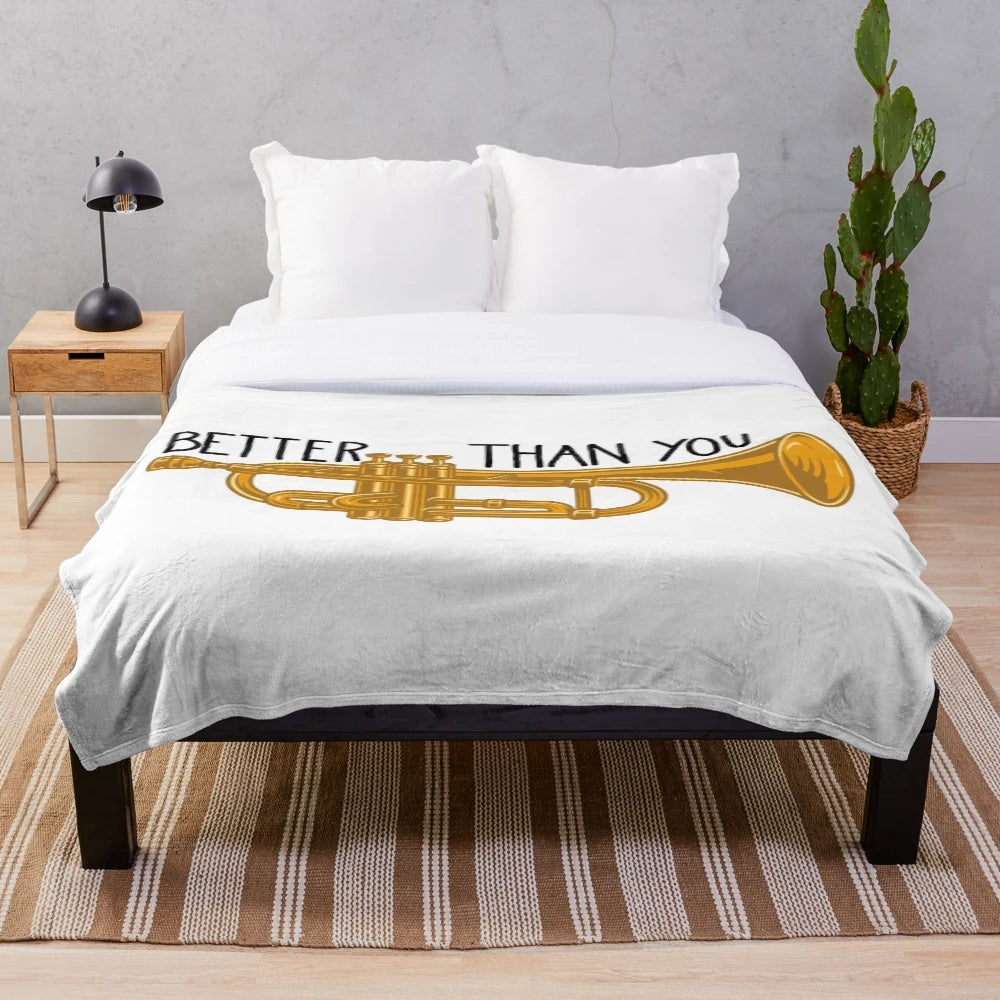 Plush blanket featuring trumpets and band-themed design