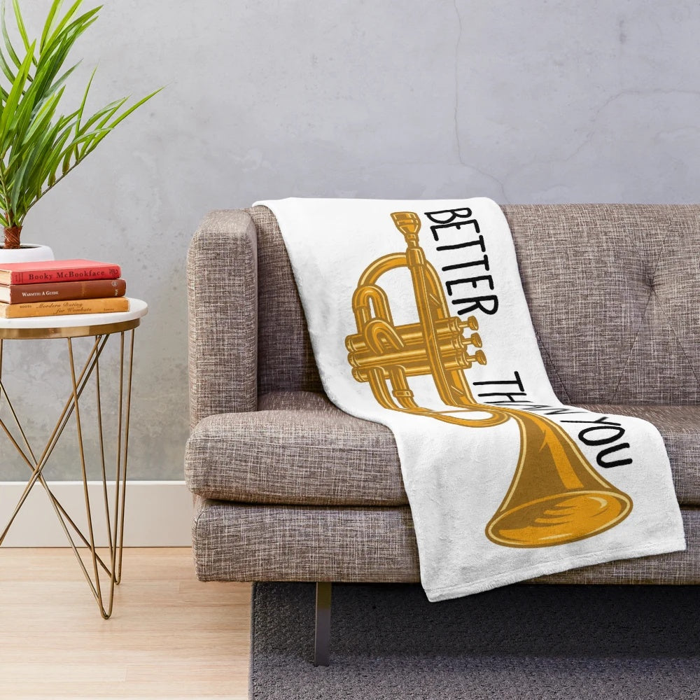 Plush blanket featuring trumpets and band-themed design
