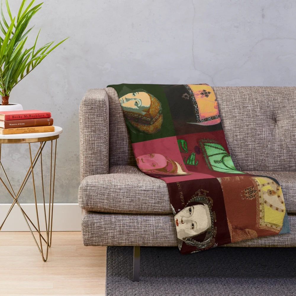 Plush blanket featuring graphic design of the six wives of Henry VIII