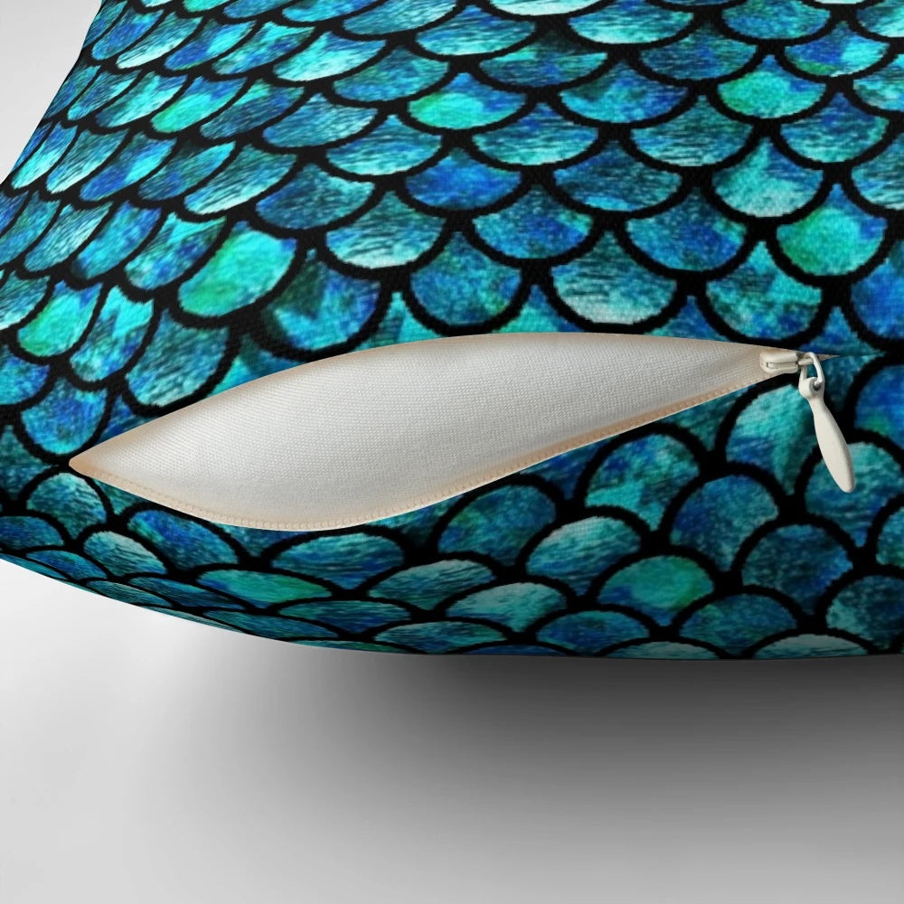 Turquoise blue pillow with mermaid scales pattern, perfect for adding a touch of the ocean to your home.