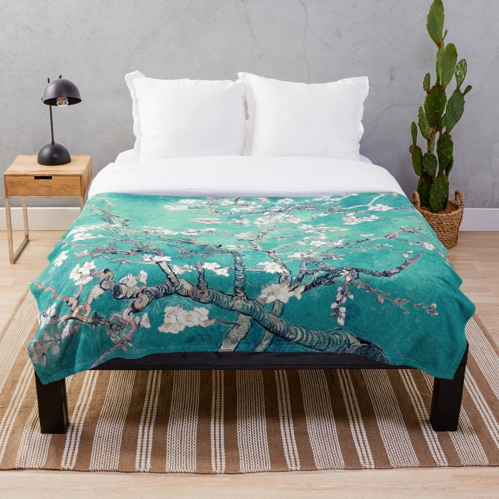 Turquoise plush blanket with Vincent Van Gogh's Almond Blossoms design