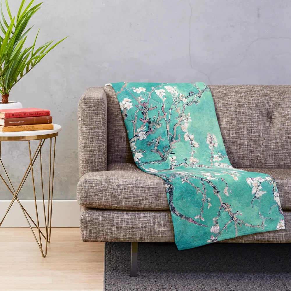 Turquoise plush blanket with Vincent Van Gogh's Almond Blossoms design