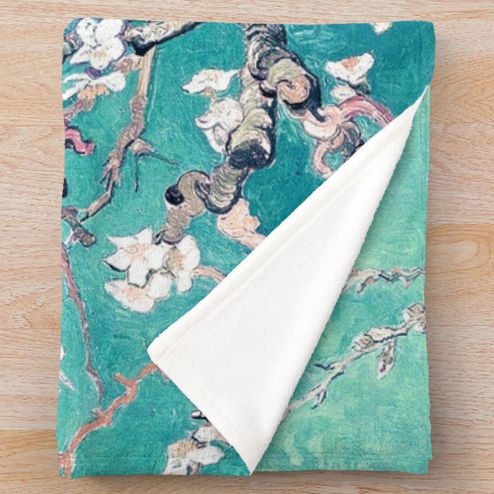 Turquoise plush blanket with Vincent Van Gogh's Almond Blossoms design