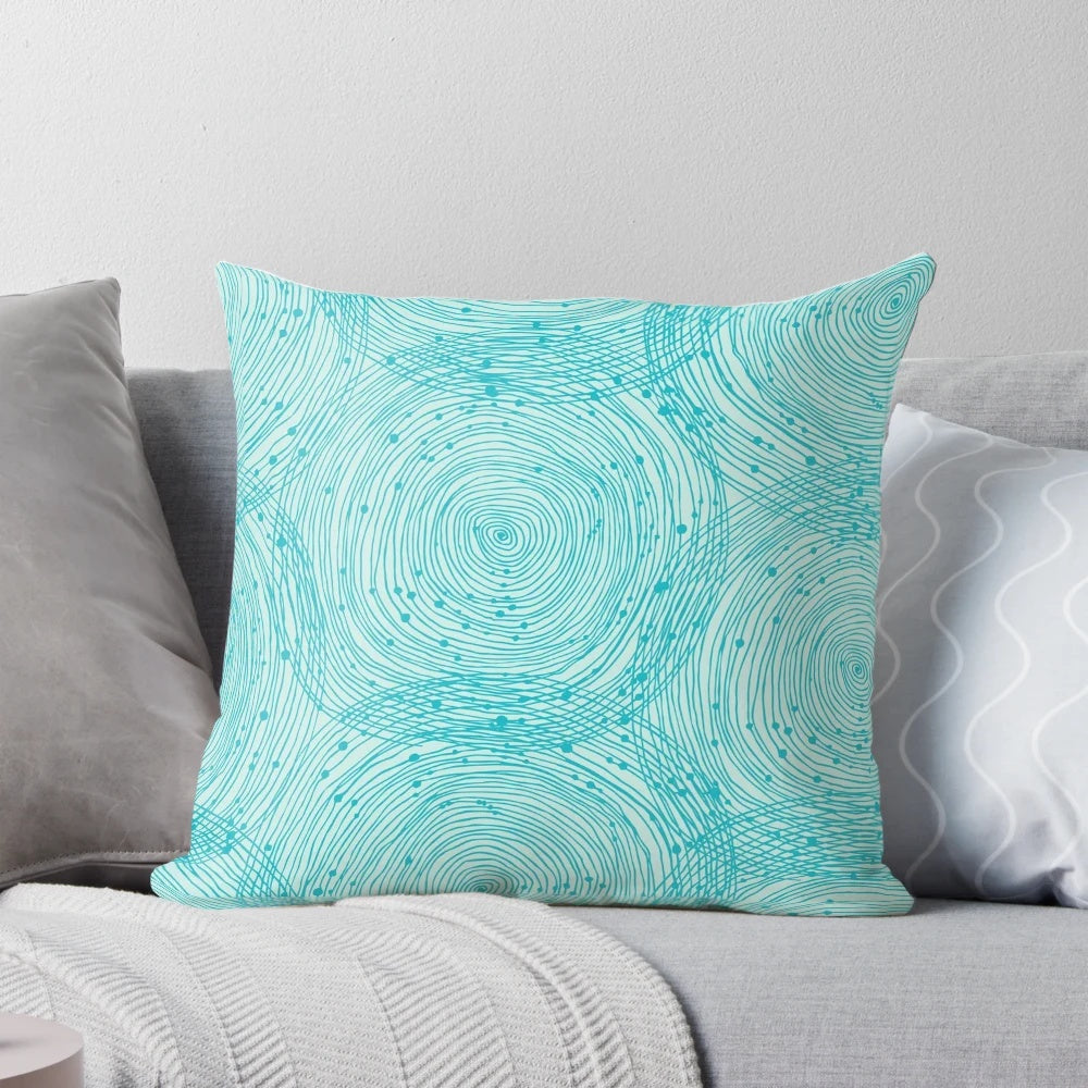 Turquoise spiral pattern pillow, a decorative vintage-inspired cushion