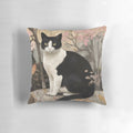 Soft, watercolor-style pillow featuring a tuxedo cat perched on a rock in a forested setting
